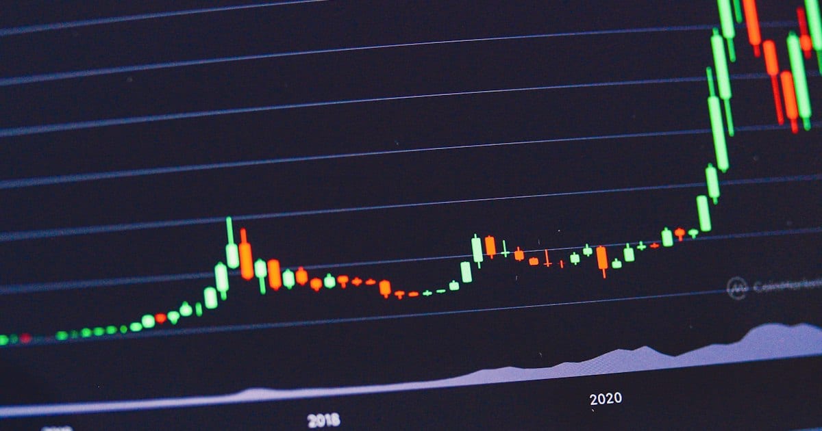 A long uptrend curving up the right-hand side of a chart on a dark screen.